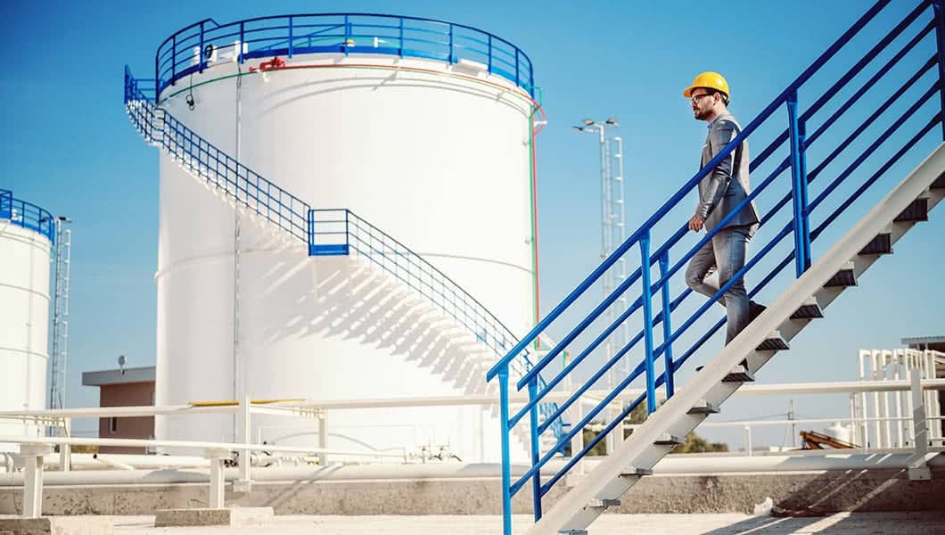 Poly Processing - Photo of worker in front of chemical tank